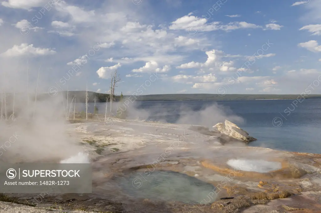 Steam emerging from natural geysers, Yellowstone Lake, Yellowstone National Park, Wyoming, USA