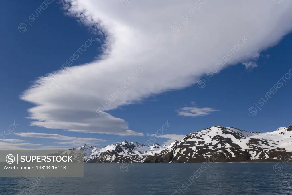 Clouds in the sky with mountains in the background, St. Andrews Bay, South Georgia Island, South Sandwich Islands