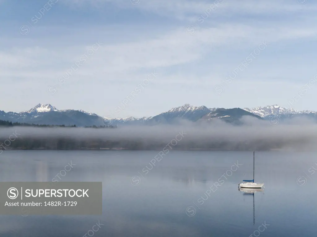 Reflection of mountains in water, Seabeck Bay, Hood Canal, Seabeck, Washington State, USA