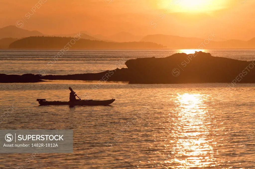 Kayakers at Sunset San Juan Island, Washington, USA