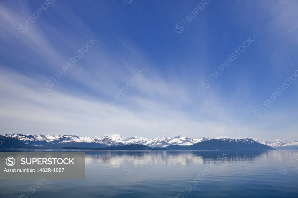 Sea with mountains in the background, Reid Glacier, Glacier Bay National Park, Alaska, USA