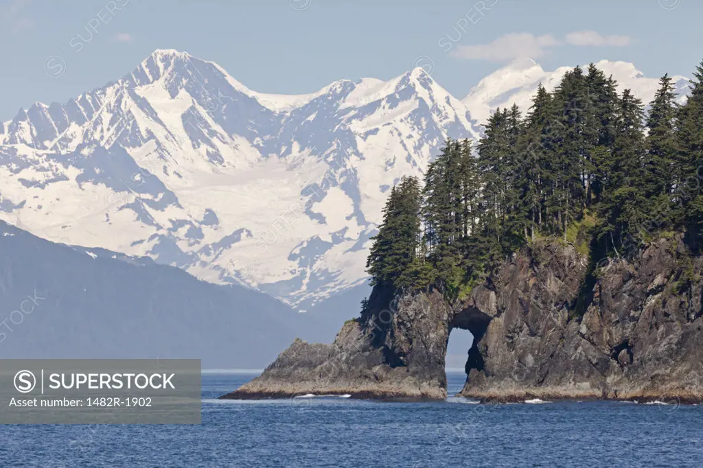 Cliff arch in the sea, Fairweather Range, Alaska, USA
