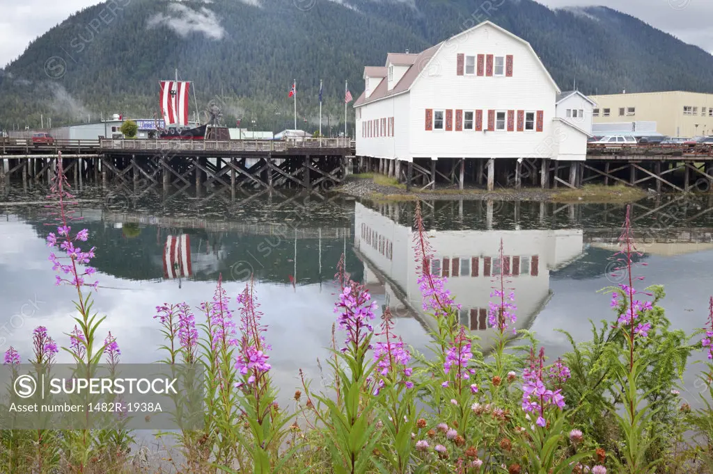 Reflection of a building in water, Sons Of Norway Hall, Petersburg, Alaska, USA