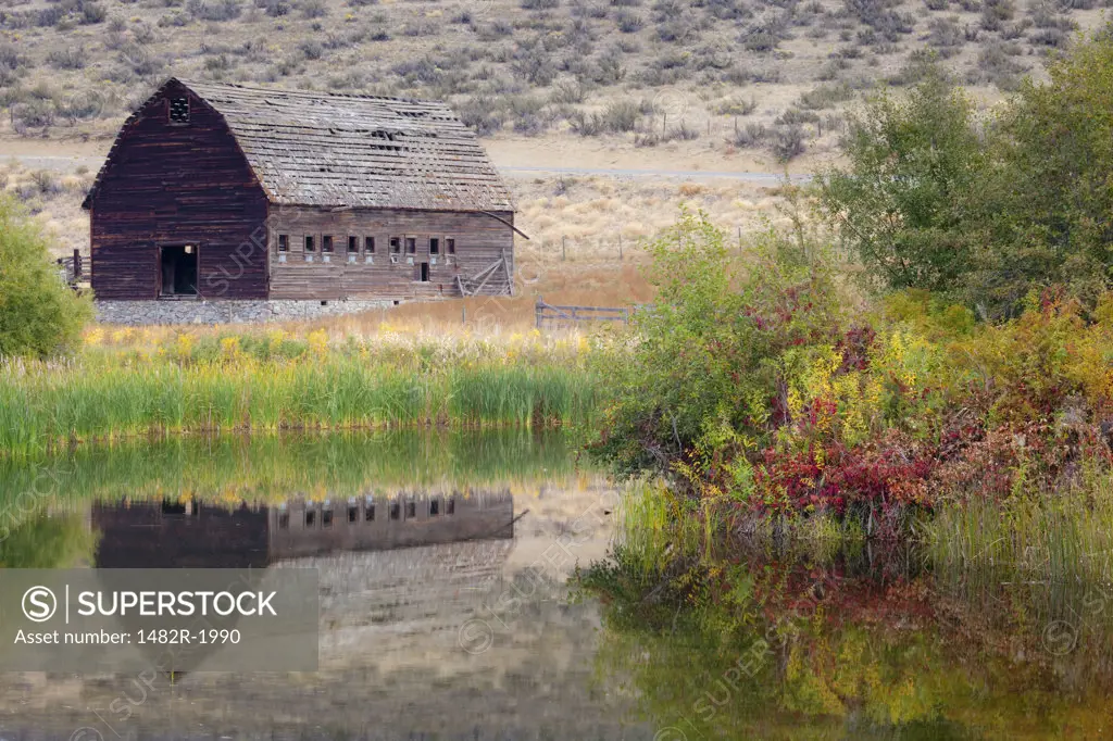 Reflection of a ranch building in pond, Haynes Ranch Buildings Preservation Project, Osoyoos, British Columbia, Canada