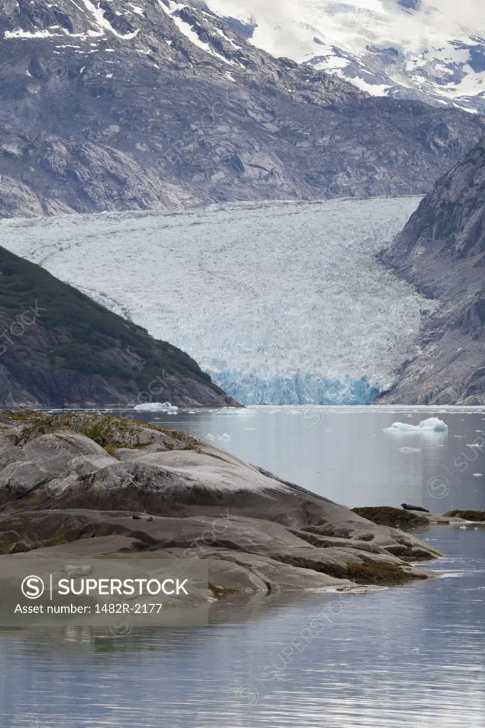 Melting glacier with mountains in the background, Endicott Glacier, Endicott Arm, Alaska, USA