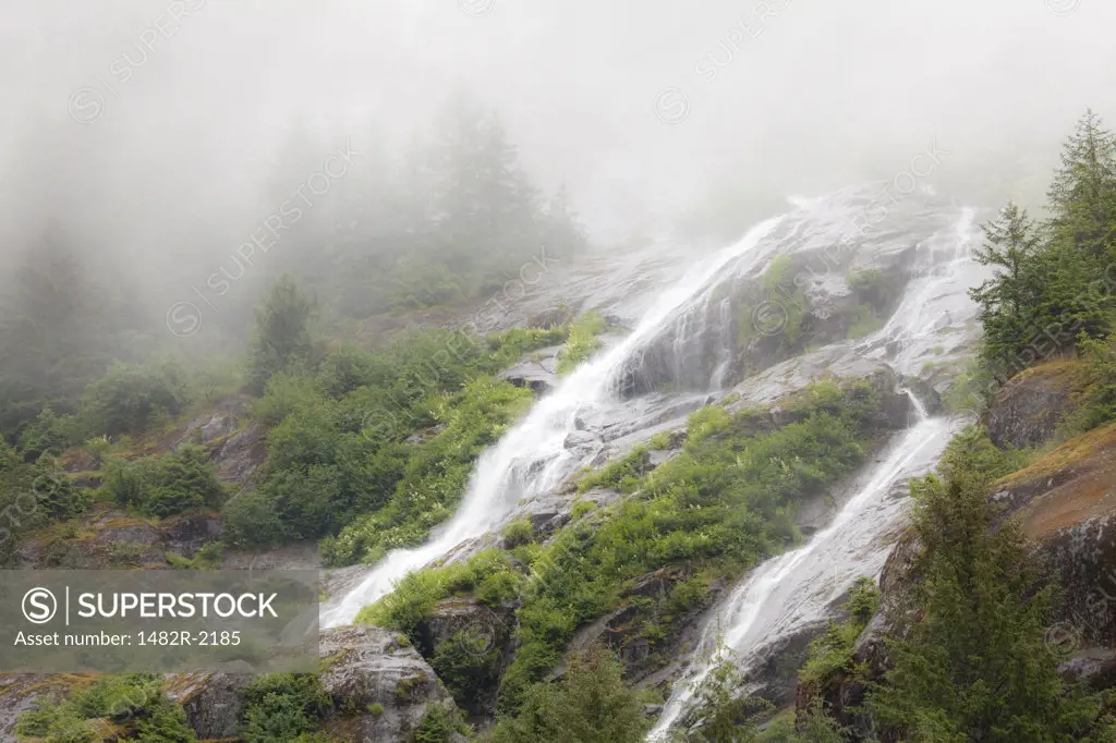 Waterfalls in fog, Endicott Arm, Alaska, USA