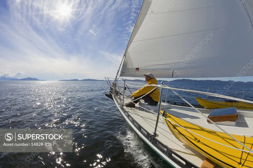 Woman sitting in SV Nawalak yacht from Orcas Island, Washington State, USA to British Columbia, Canada