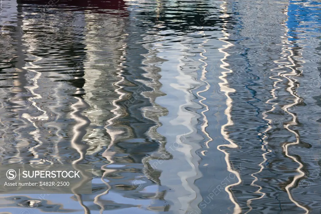 Abstract reflections of sailboats in water, Seaport Village, San Diego, California, USA