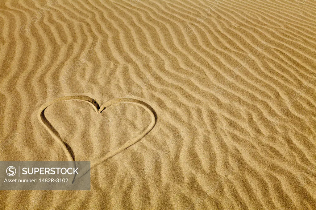Heart shape drawn on sand on the beach, Pacific Beach, Washington State, USA