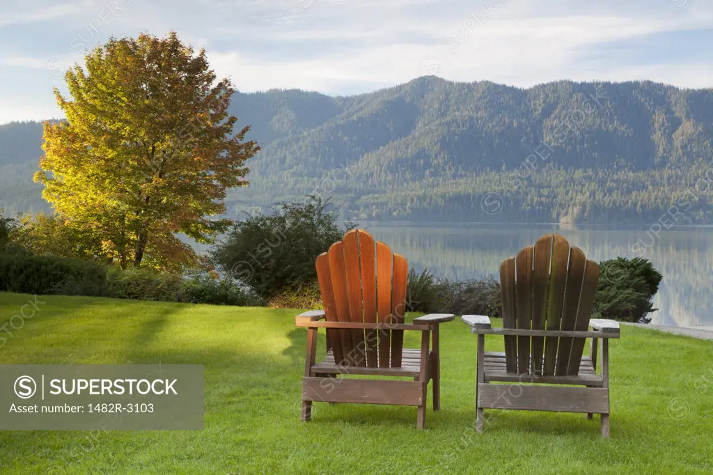 Adirondack chairs in a lawn at the lakefront, Lake Quinault Lodge, Quinault, Olympic National Park, Washington State, USA