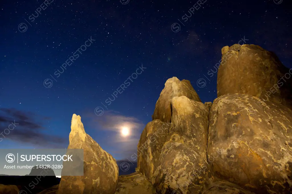 USA, California, Predawn sky with moon, Alabama Hills, near Lone Pine