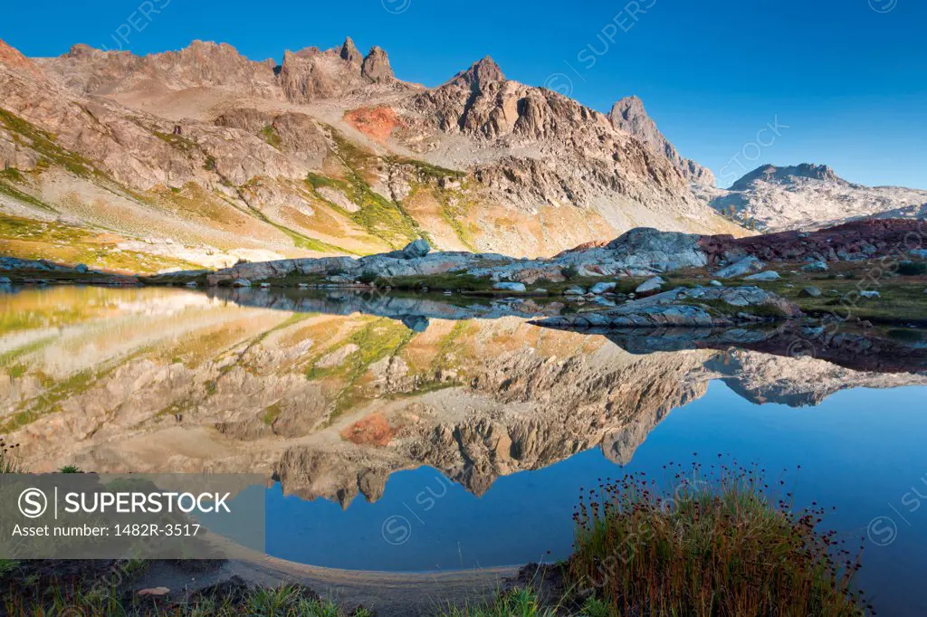 Reflection of mountains in a lake, Ediza Lake, Ansel Adams Wilderness, Inyo National Forest, California, USA