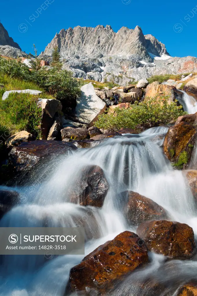 Stream flowing through rocks in a lake, Ediza Lake, Mt Ritter, Ansel Adams Wilderness, Inyo National Forest, California, USA