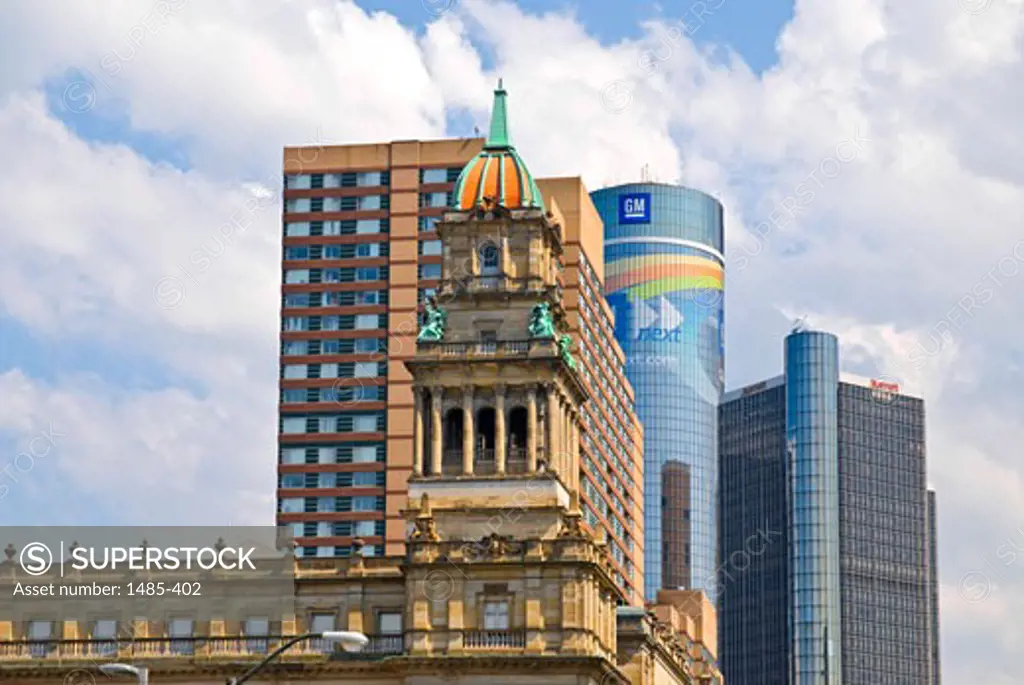 Low angle view of a government building in front of skyscrapers, Old Wayne County Building, Renaissance Center, Detroit, Wayne County, Michigan, USA
