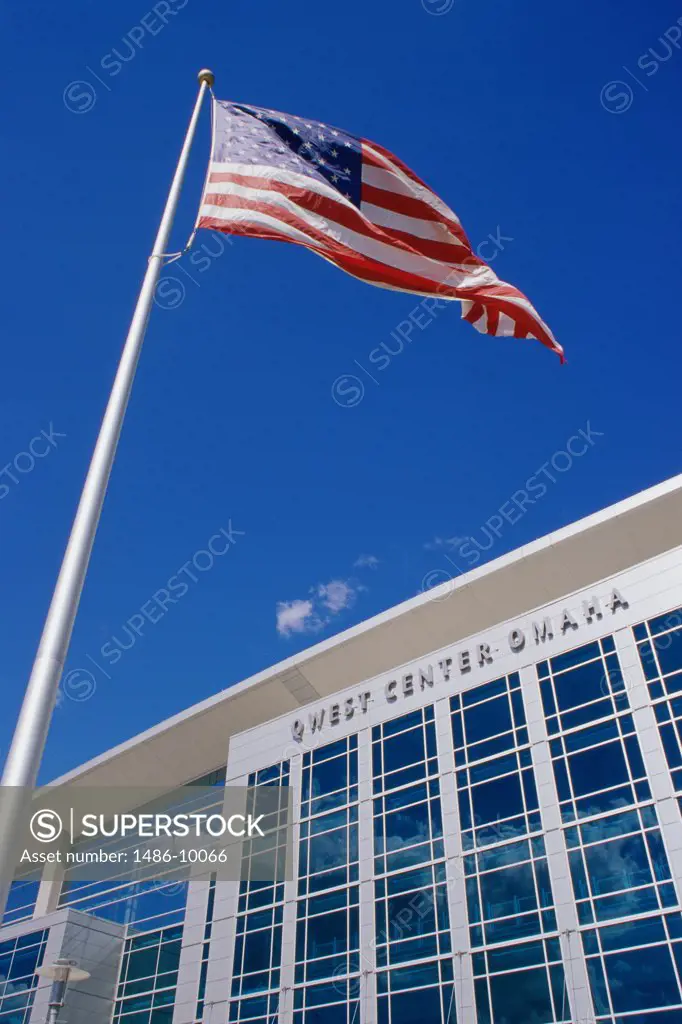 Low angle view of an American flag in front of a government building, Qwest Center Omaha, Omaha, Nebraska, USA