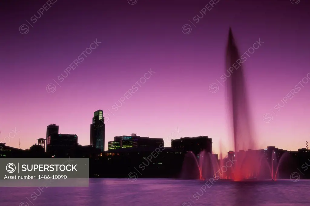 Silhouette of buildings on the waterfront, Heartland of America Park, Omaha, Nebraska, USA