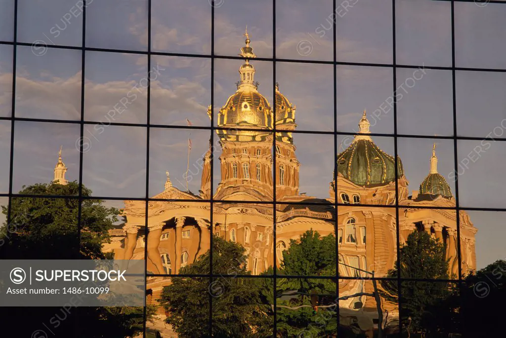 Reflection of a government building on the glass of a building, State Capitol, Des Moines, Iowa, USA