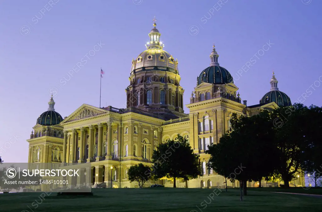 Low angle view of a government building lit up at dusk, State Capitol, Des Moines, Iowa, USA