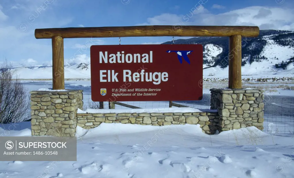 Sign hanging from wooden posts, National Elk Refuge, Wyoming, USA