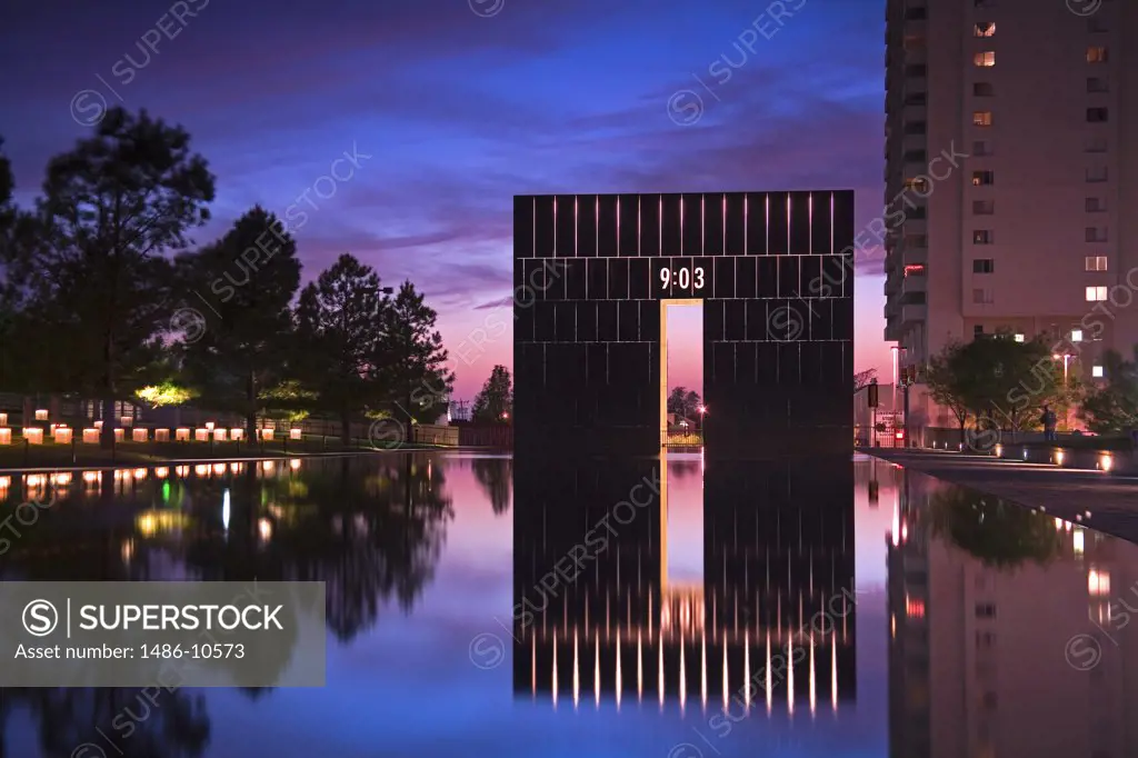 Reflection of a memorial and trees in water, Gate of Time, Oklahoma City National Memorial, Oklahoma City, Oklahoma, USA