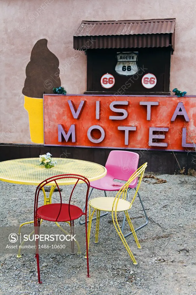 Empty chairs and a table in front of a motel, Snow Cap Drive In, Route 66, Seligman, Arizona, USA