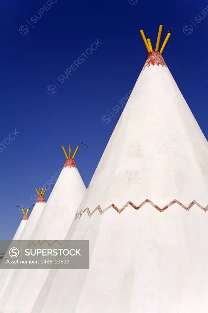 Low angle view of teepees in a row, Wigwam Motel, Holbrook, Route 66, Arizona, USA