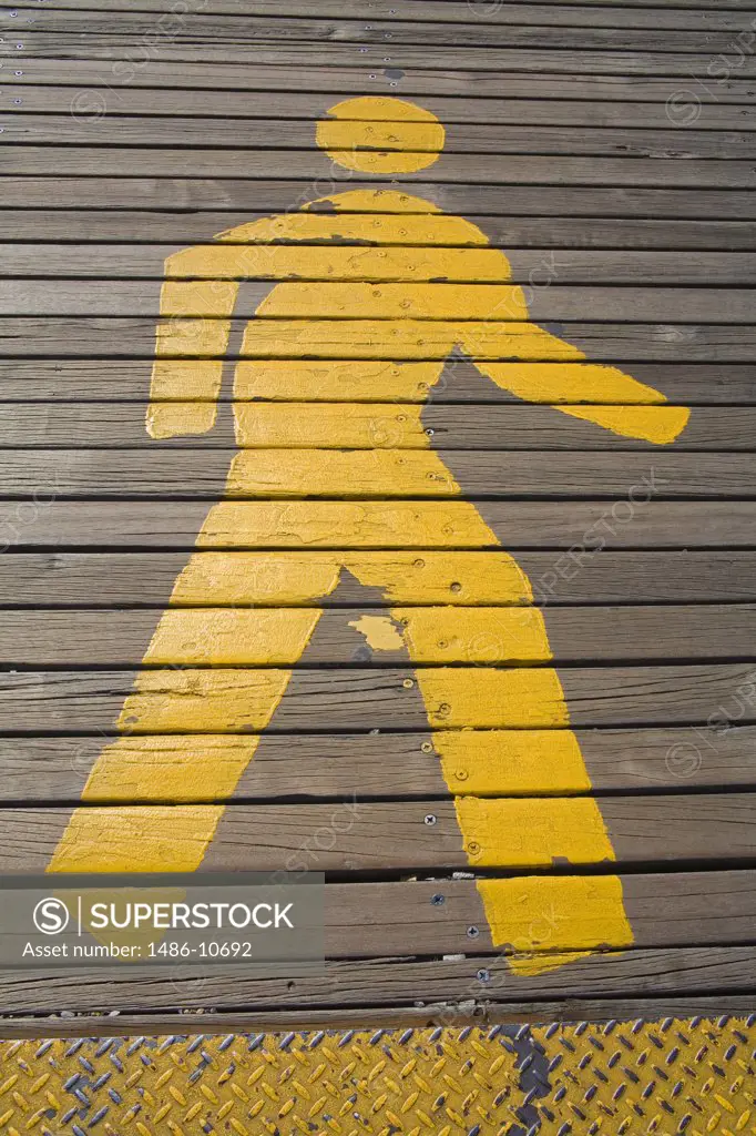 High angle view of a pedestrian crossing sign painted on a walkway