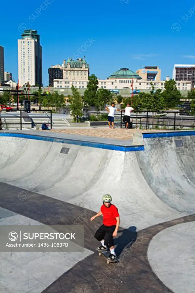 High angle view of a man skateboarding, The Forks, Winnipeg, Manitoba, Canada