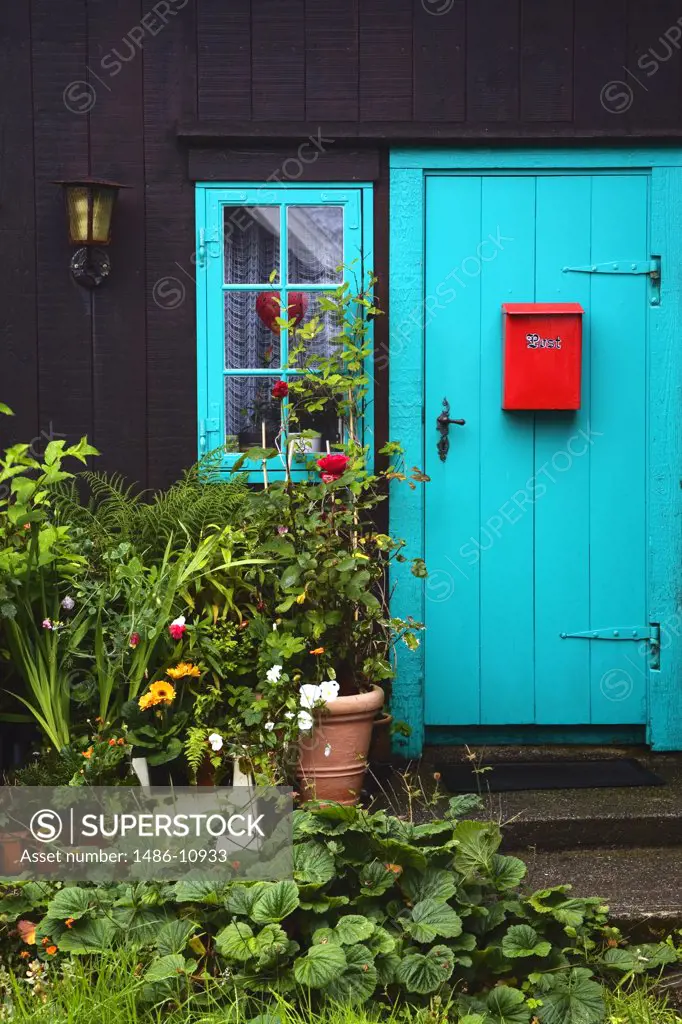 Red mailbox on the door of a house, Tinganes, Torshavn, Faroe Islands, Denmark