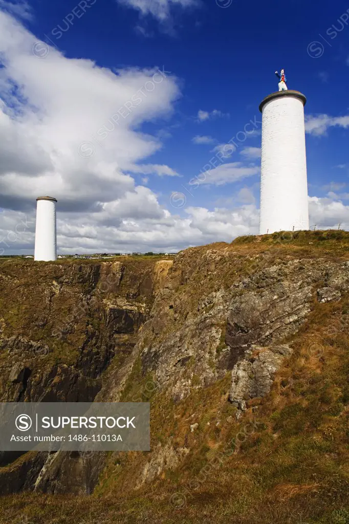 Low angle view of two beacon towers, Metal Man, Tramore, County Waterford, Munster Province, Ireland