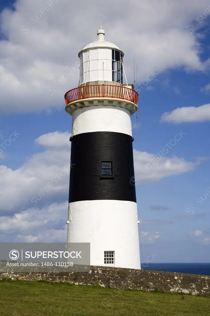 Low angle view of a lighthouse at the seaside, Mine Head Lighthouse, County Waterford, Munster Province, Ireland