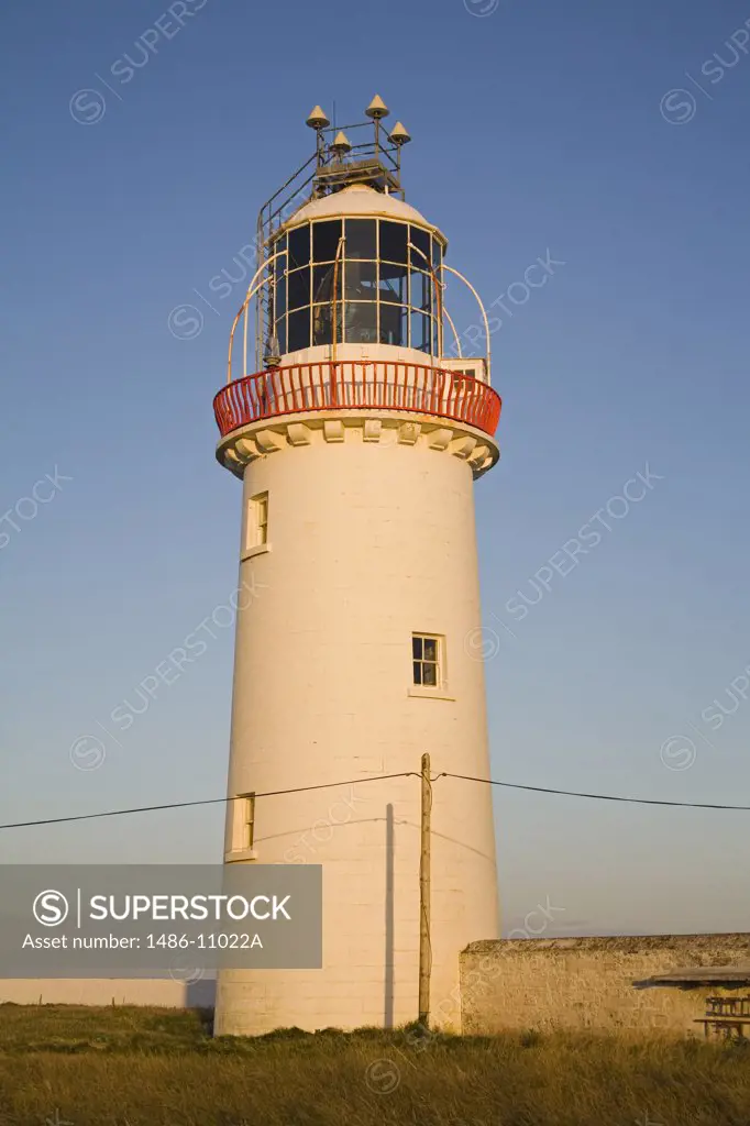 Low angle view of a lighthouse on a hill, Loop Head Lighthouse, County Clare, Munster Province, Ireland