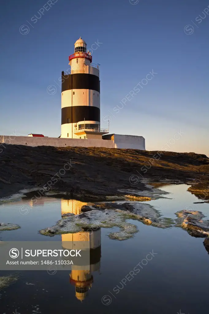 Reflection of a lighthouse in water, Hook Head Lighthouse, Hook Head, County Wexford, Leinster Province, Ireland