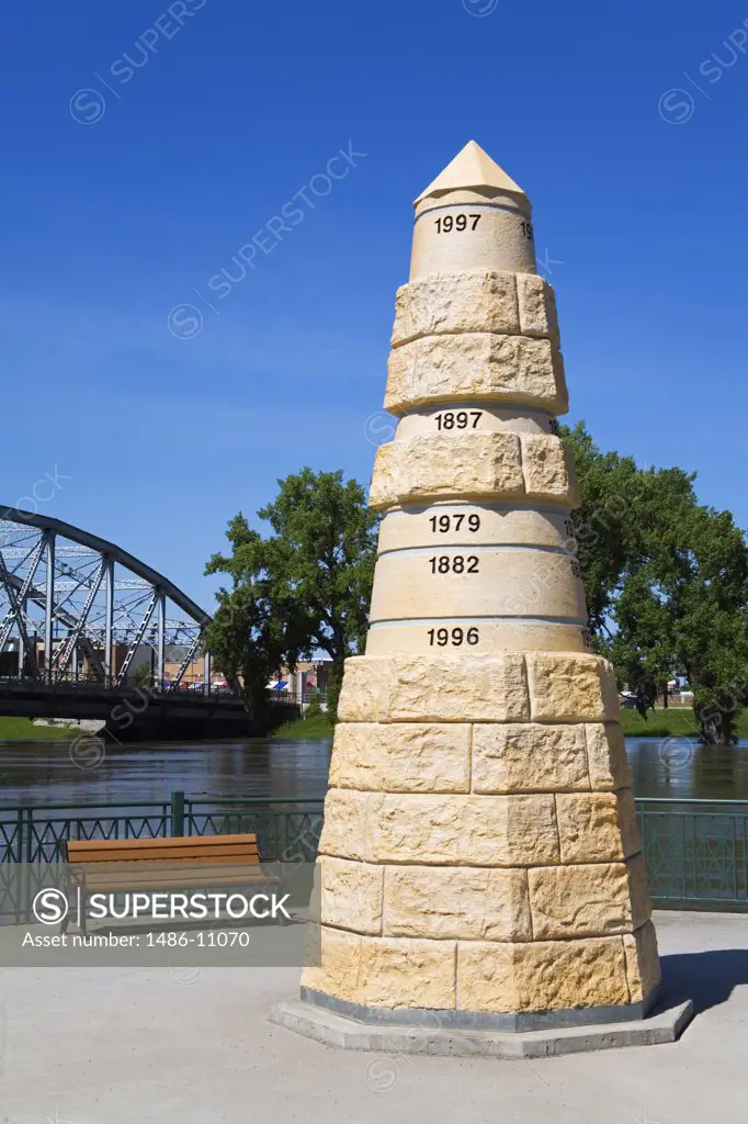 Monument at a riverside, Flood Memorial, Grand Forks, Red River, North Dakota, USA