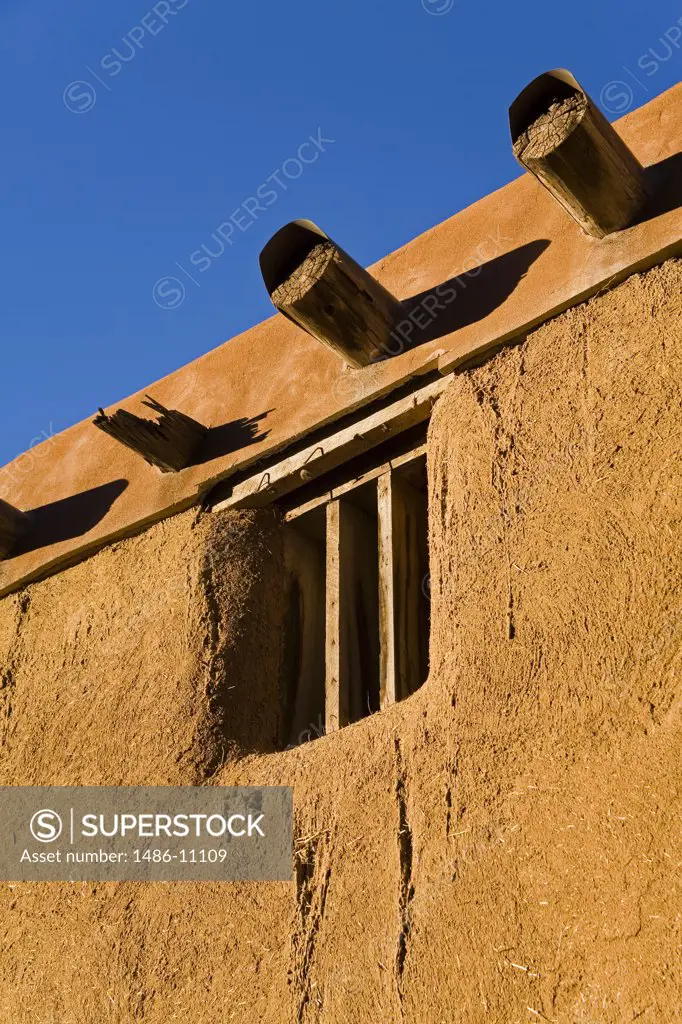 Low angle view of a window of an adobe house, Santa Fe, New Mexico, USA