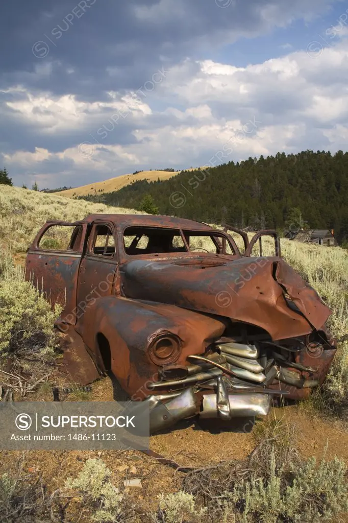 Abandoned car in a field at a ghost town, Comet, Butte Region, Montana, USA