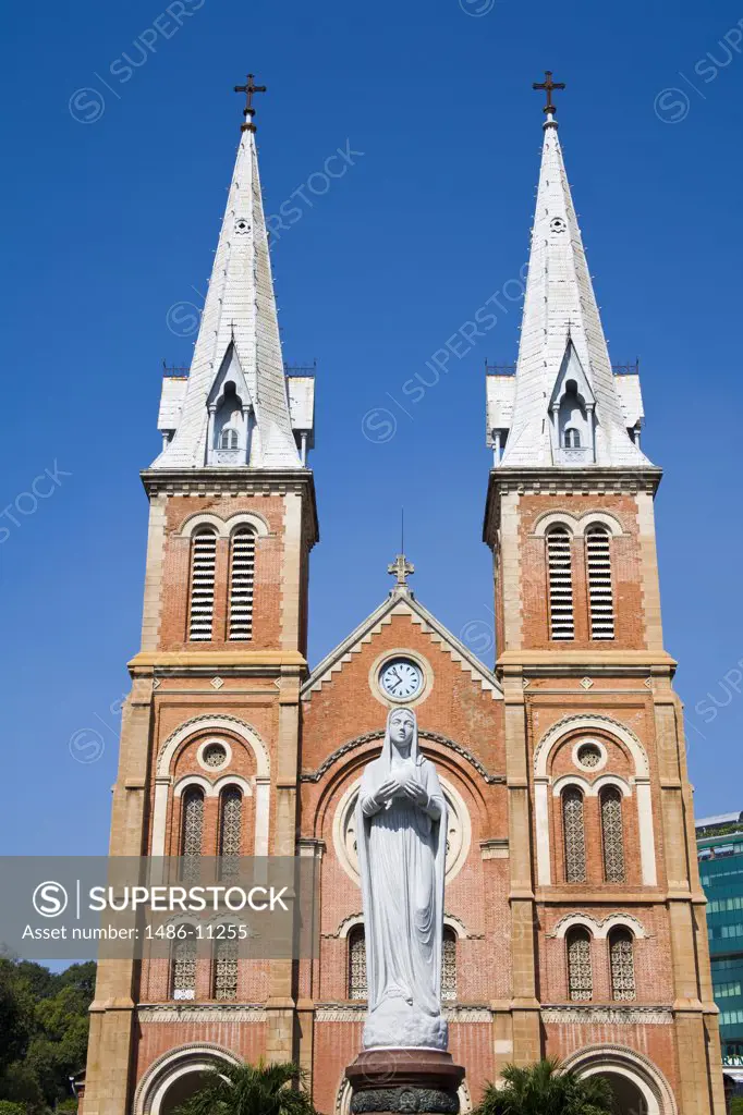 Low angle view of a statue in front of a cathedral, Notre Dame Cathedral, Ho Chi Minh City, Vietnam