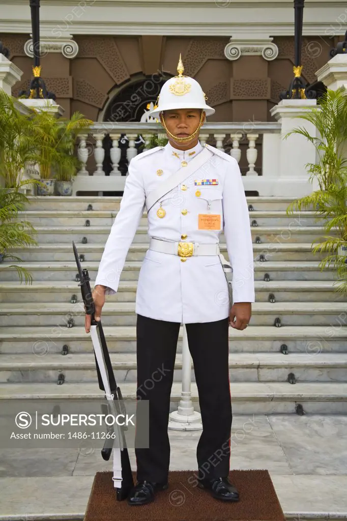 Security guard standing in front of a palace, Grand Palace, Rattanakosin District, Bangkok, Thailand