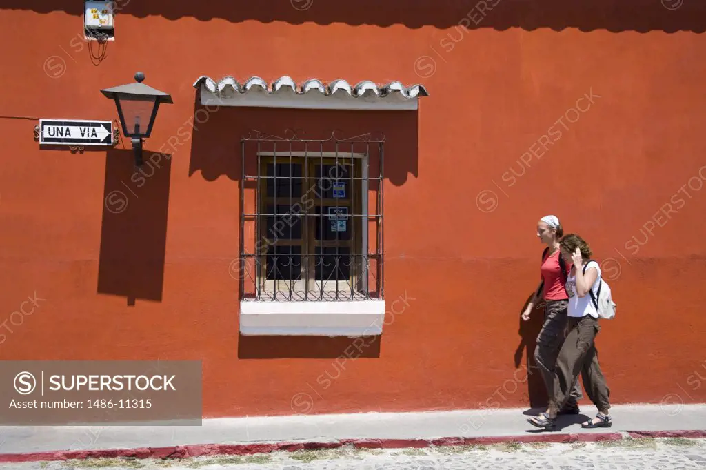 Tourists walking on a sidewalk, Antigua, Guatemala