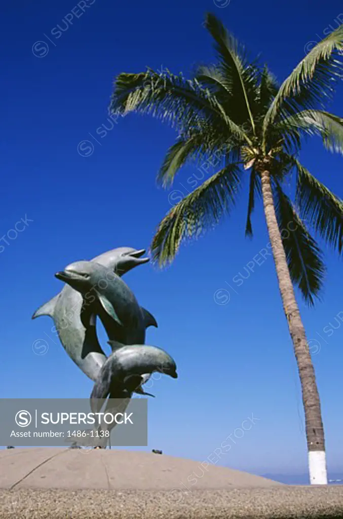 Statue of dolphin on the beach, Puerto Vallarta, Mexico