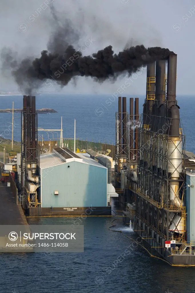Smoke emerging from smoke stacks of an oil power plant, Puerto Quetzal, Guatemala