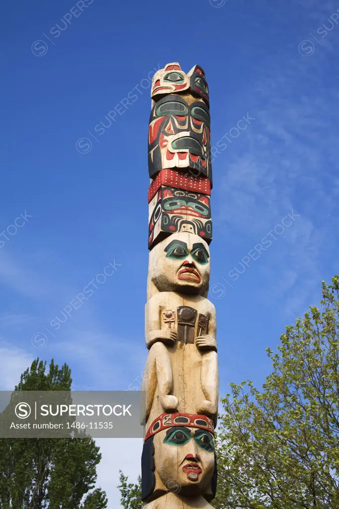 Low angle view of a totem pole, Honor Pole, Center For Wooden Boats, Seattle, King County, Washington State, USA