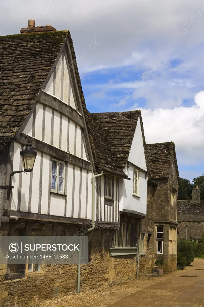 Tudor style houses in a row, Church Street, Lacock, Wiltshire, England