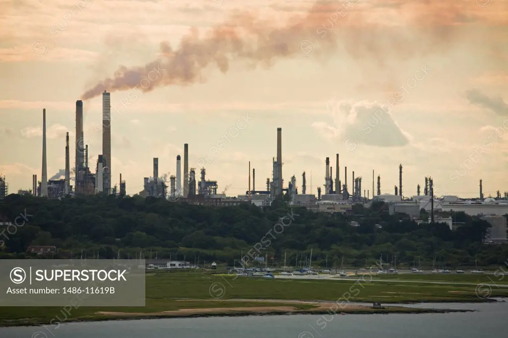 Smoke stacks at a refinery, Fawley Oil Refinery, Southampton, Hampshire, England