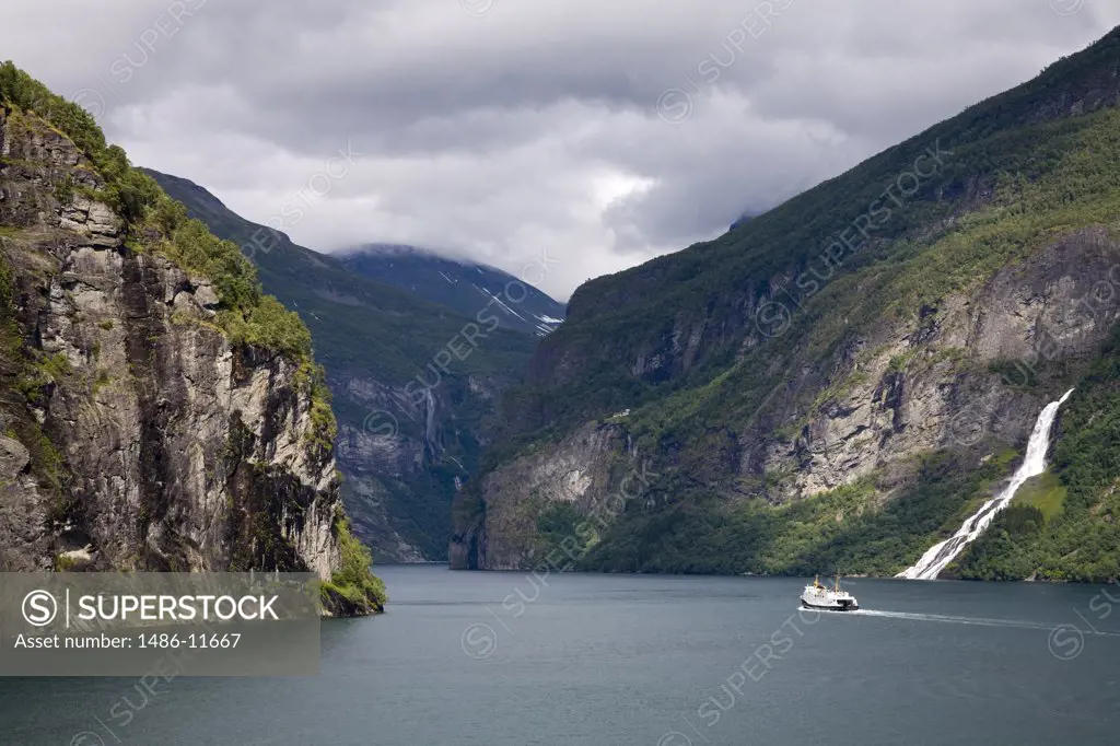 Ferry in the fjord with mountains in the background, Geirangerfjord, More og Romsdal, Sunnmore, Norway