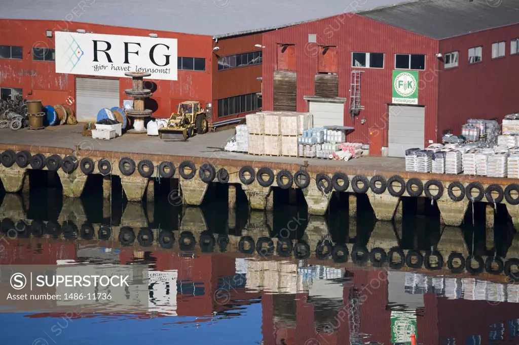 Reflection of warehouses in water, Tromso, Toms County, Nord-Norge, Norway