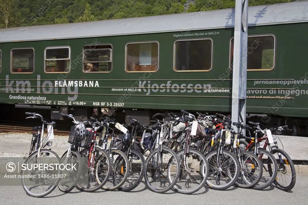 Bicycle parked at a railway station in front of a railroad car, Flam Station, Flam, Aurlandsfjord, Sogn Og Fjordane, Norway