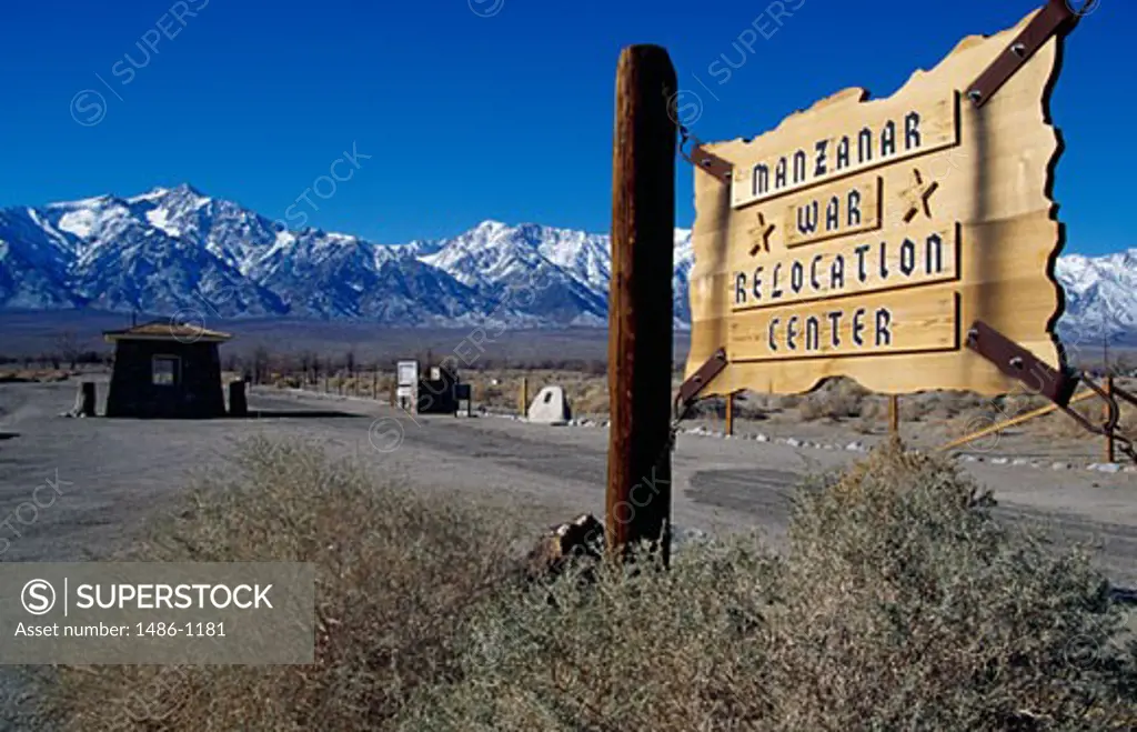 Signboard with mountains in the background, Manzanar War Relocation Center, California, USA