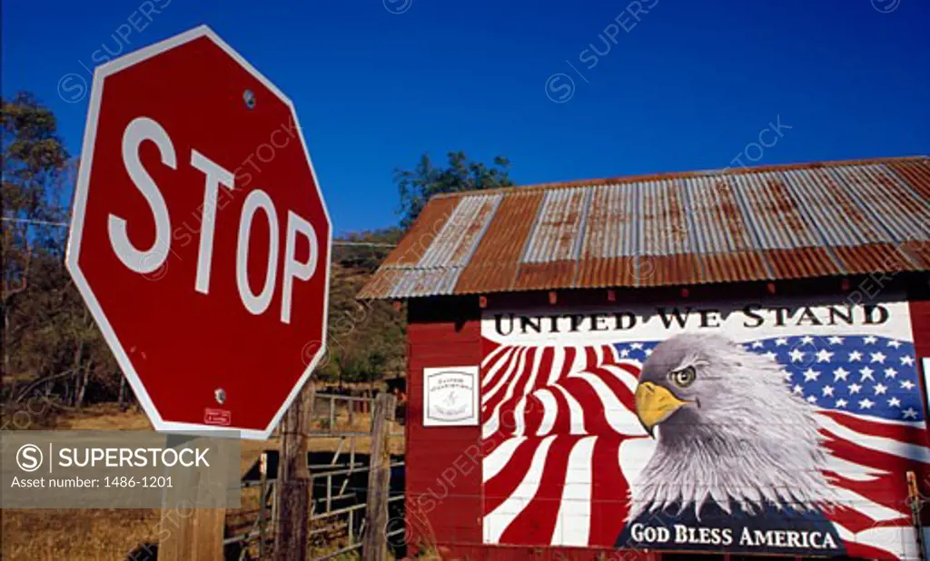 USA, California, God Bless America mural by stop sign, Ally Savage