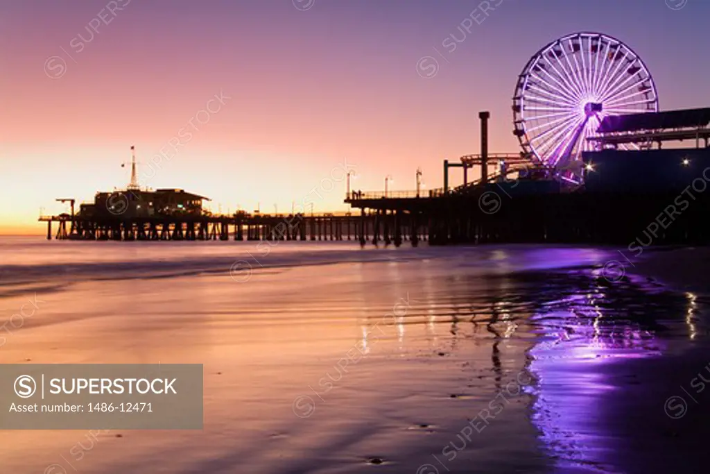 Ferris wheel lit up near a pier, Santa Monica Pier, Santa Monica, Los Angeles County, California, USA